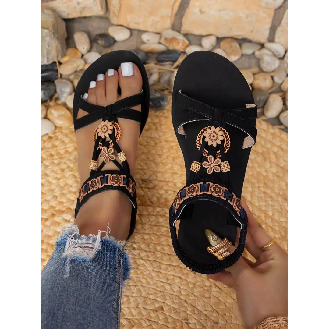 Schwarze flache Sandalen mit goldfarbenen Blumenmotiven im orientalischen Stil für Damen