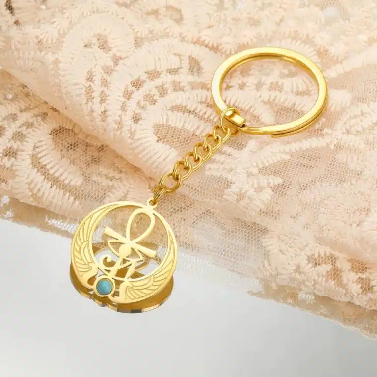 Porte-clés Ankh doré avec aile et pierre turquoise