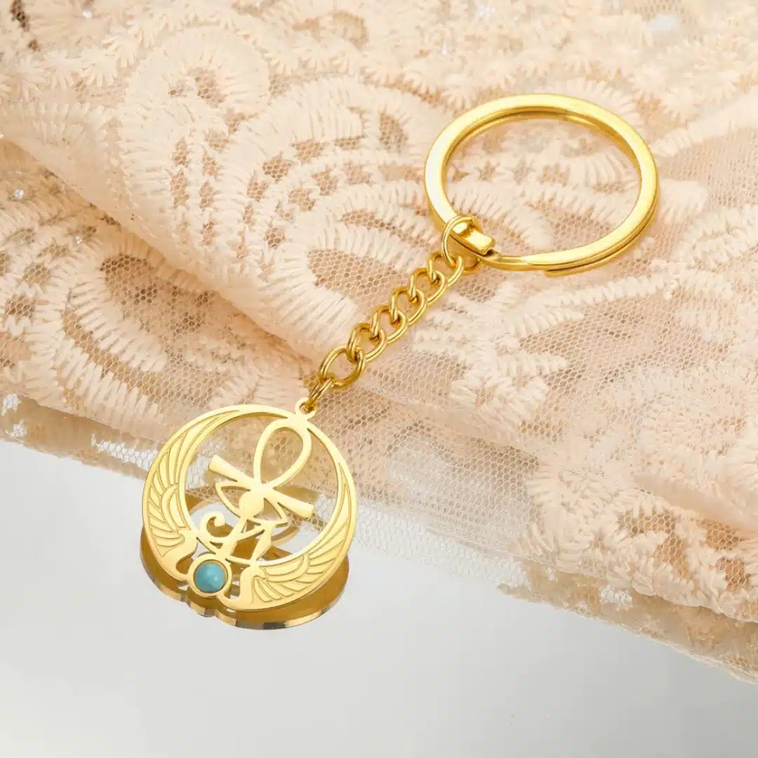 Porte-clés Ankh doré avec aile et pierre turquoise