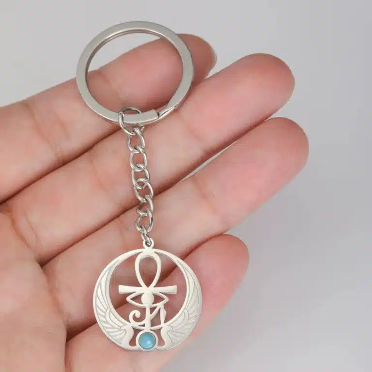 Porte-clés Ankh doré avec aile et pierre turquoise