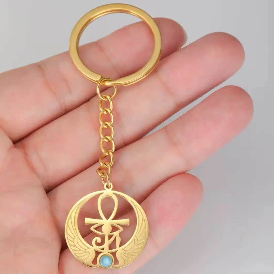 Porte-clés Ankh doré avec aile et pierre turquoise